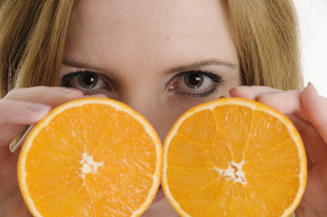 face behind the oranges