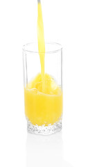 Juice pouring into glass isolated on white