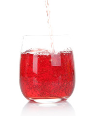 Juice pouring into glass isolated on white