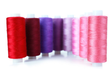 Colored spools of threads isolated on white