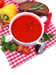 Tasty tomato soup and vegetables, isolated on white