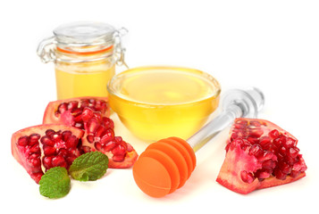 Sweet honey with pomegranate isolated on white