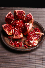 Ripe pomegranate on table close-up