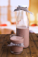 Chocolate milk in bottle and glass,