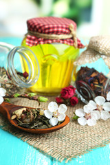 Fototapeta na wymiar Assortment of herbs and tea and honey in glass jars