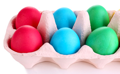 Colorful Easter eggs in tray isolated on white