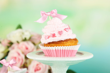 Tasty cup cake with cream, close up