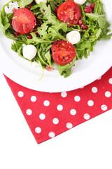 Green salad made with  arugula, tomatoes, cheese mozzarella