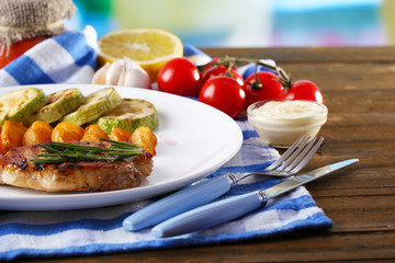 Grilled steak, grilled vegetables and fried potato pieces