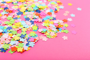 Confetti on pink background