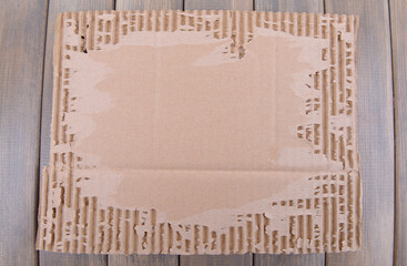 Cardboard on wooden background