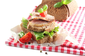 Delicious sandwiches with meet on table close-up