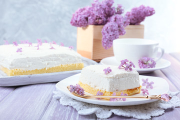 Delicious dessert with lilac flowers
