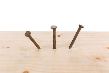 Nails in wooden board close-up