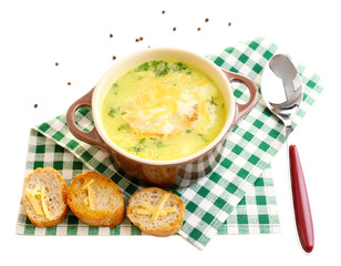 Tasty soup in saucepan, isolated on white