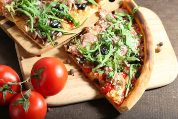 Piece of pizza with arugula