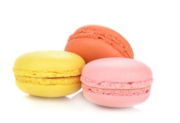 A group of traditional French macaroons on a white background