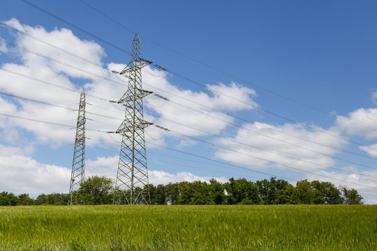 Electric masts on a field