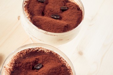 close-up of italian tiramisu dessert served in a cup