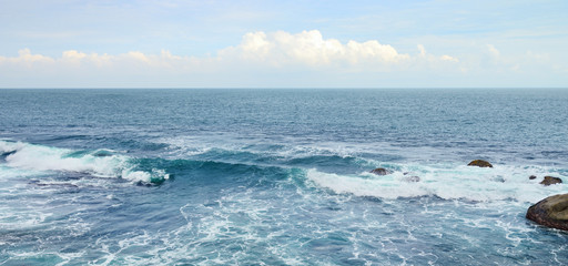 Naklejka na ściany i meble Beautiful ocean waves and blue sky