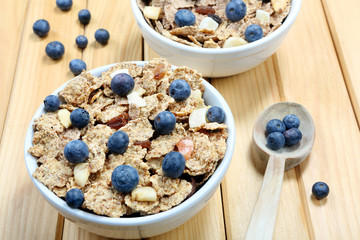 Healthy whole grain muesli and bran breakfast with fruits