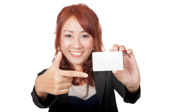 Asian office girl happy point to a blank card focus on the card