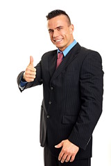 Handsome young man in suit showing thumb up