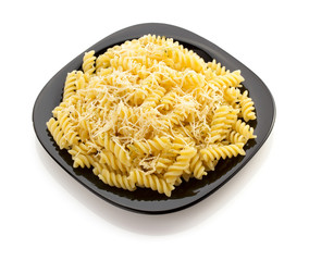pasta fusilli in plate on white