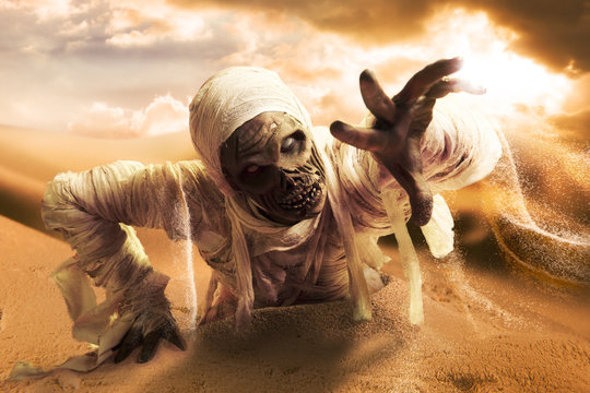 Scary Mummy In A Desert At Sunset