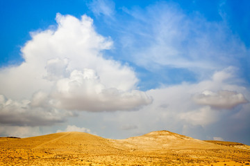 Fototapeta na wymiar Desert with cloudy sky in Israel