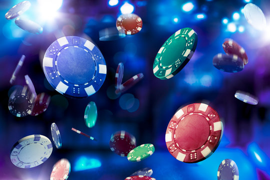 High contrast image of casino chips falling