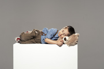 small boy sleep with bear