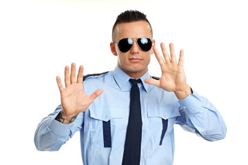Young police man in uniform shows you his hands