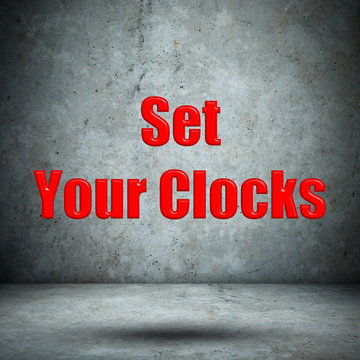 Set Your Clocks concrete wall