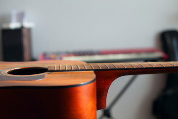 Acoustic guitar lying on the table