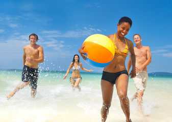 Young people having fun on the beach