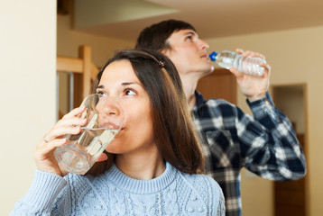 Young couple  drinking clean water