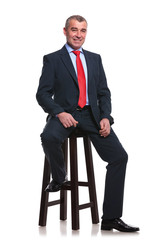 business man on high stool