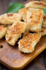 Sesame chicken nuggets on a rustic cutting board
