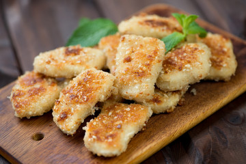 Chicken nuggets decorated with mint leaves, horizontal shot