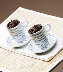 coffee cups full of coffee beans