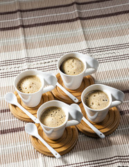 cups of coffee on place mats