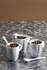 coffee cups full of coffee beans