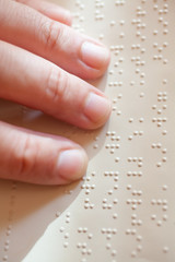 Blind reading text in braille language - 64563365