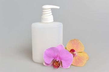 Obraz na płótnie Canvas Intimate gel or liquid soap dispenser pump plastic bottle orchid