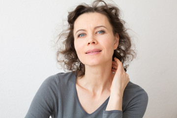 Romantic woman looking into camera with smile
