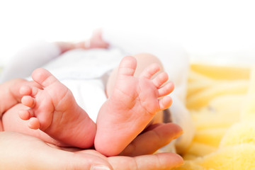 Baby's foot in mother hands