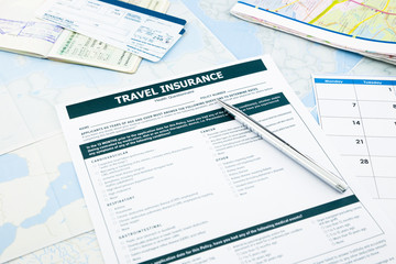 travel insurance form, passport and tickets