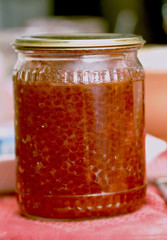 Red caviar in glass jar