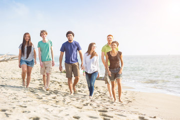 Multiracial Group of Friends Walking at Beach